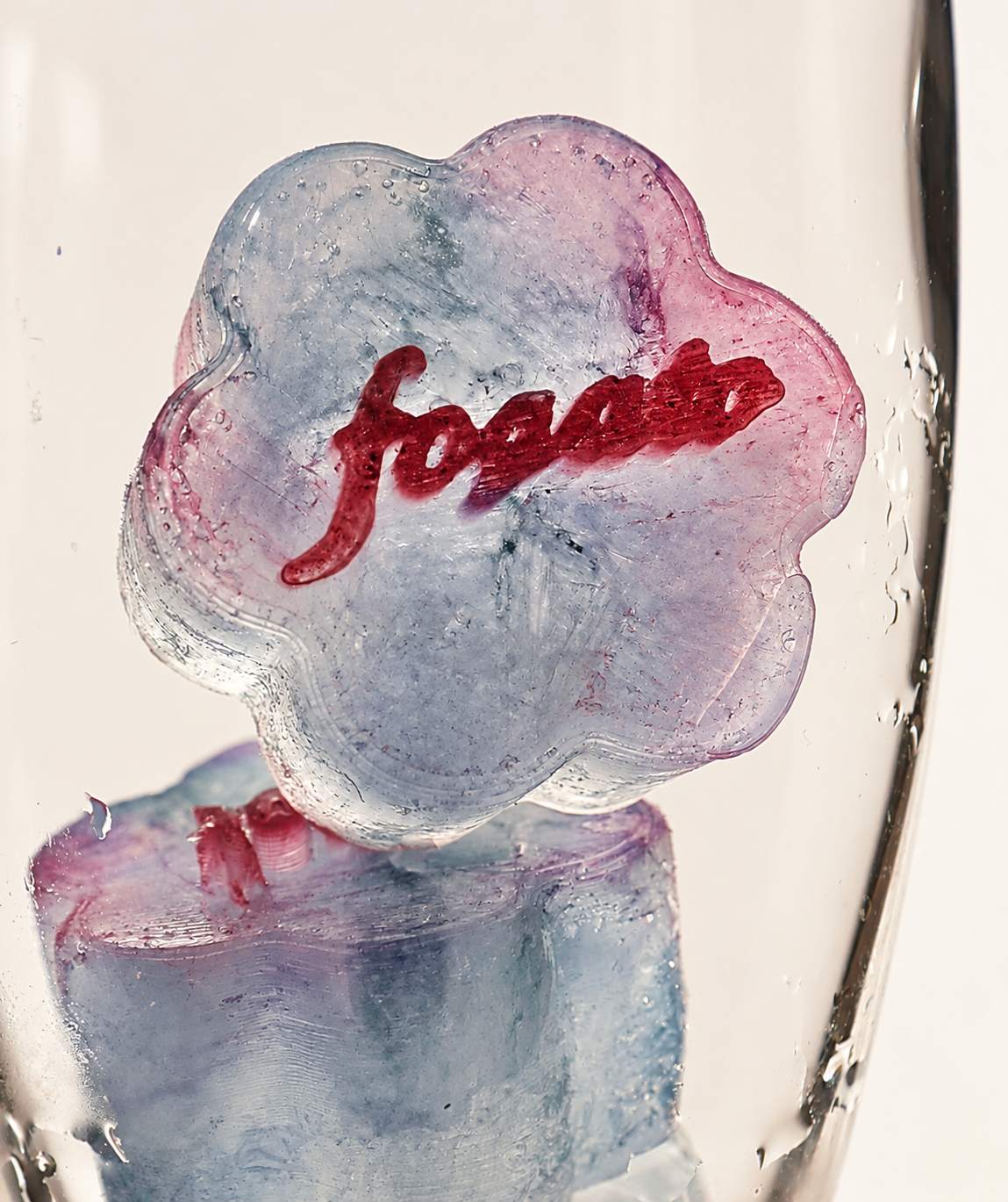 Fogato lettering inside a flower-shaped ice cube